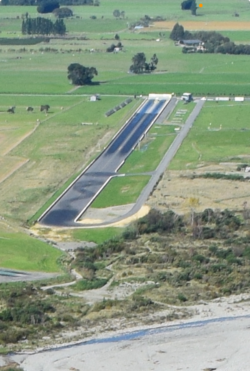 An aerial view of the Hood Aerodrome runway and the Waingawa River