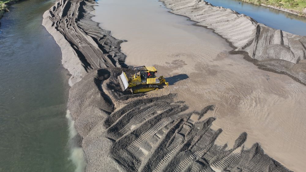 Bird's eye view of a bulldozer working in the Waikanae River