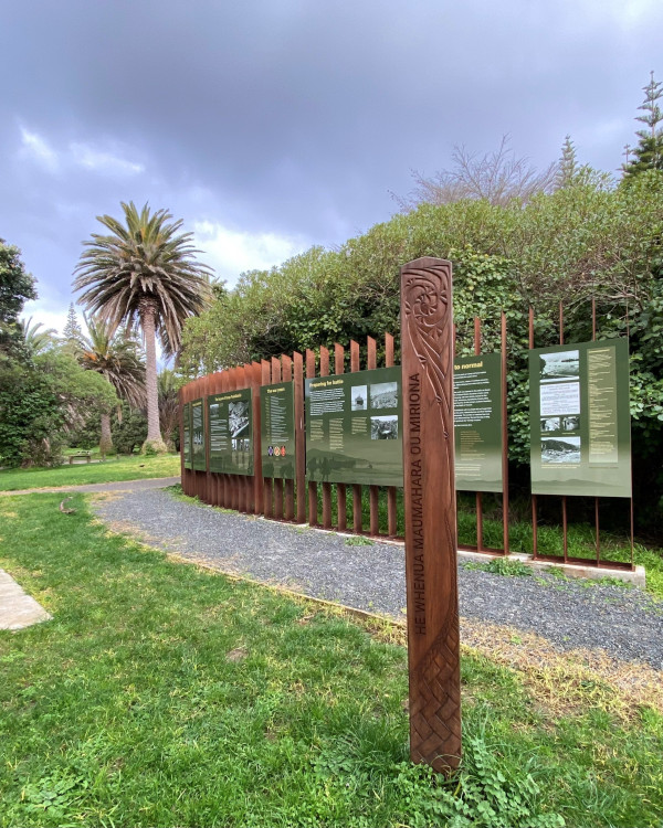 Signs about the former Camp Paekākāriki