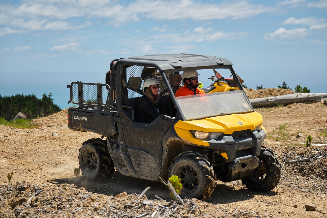 Staff from Greater Wellington's pest team in a UTV at Akatarawa Park