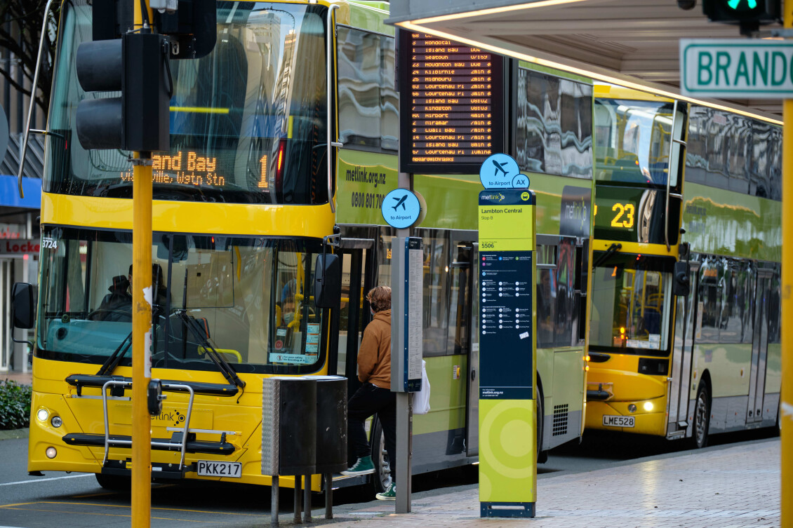 Two double decker buses at a bus stop in the Wellington CBD