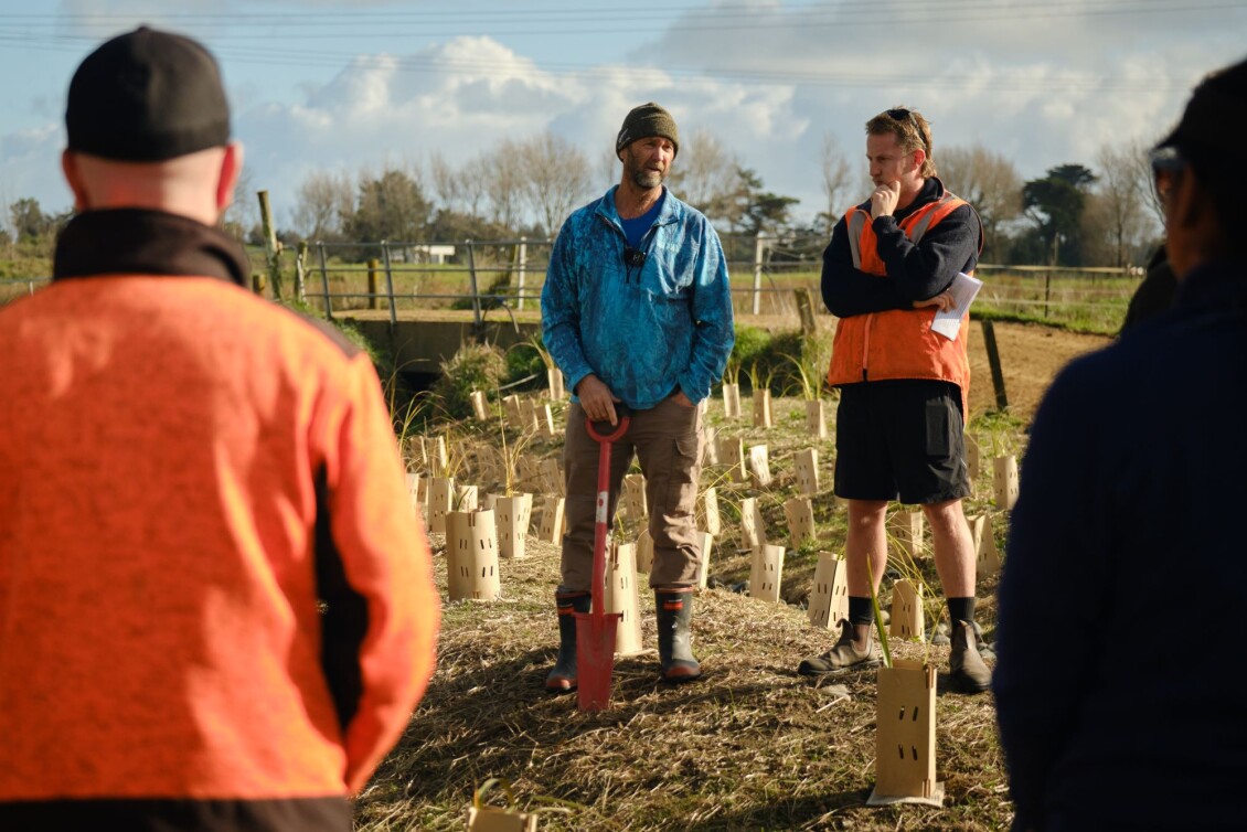 Shane Walker (left) and Jamie Peryer (right), standing in front of a field of newly planted seedlings